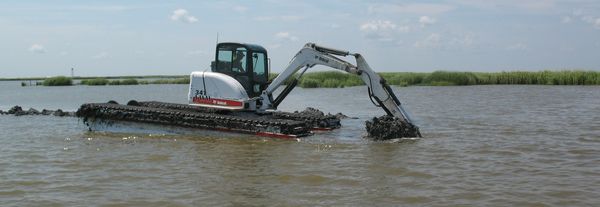 Marsh excavator in water